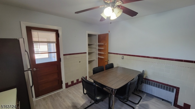 18 Howard Place, Unit 1 Nutley, NJ 07110 - Photo 5 of 17 a view of a room with furniture and wooden floor
