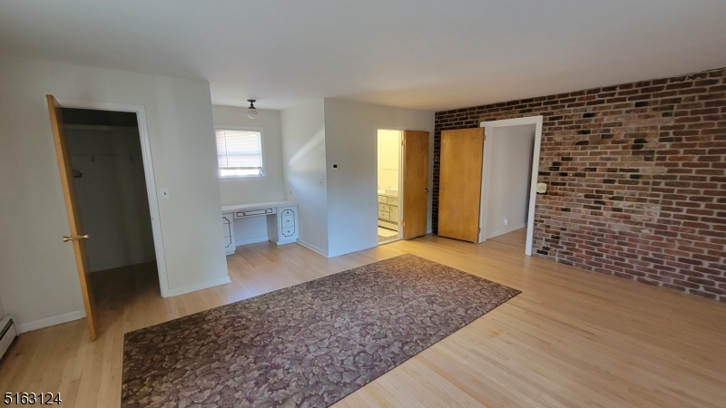18 Howard Place, Unit 1 Nutley, NJ 07110 - Photo 6 of 17 a view of empty room with wooden floor