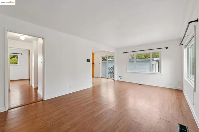 a kitchen with a sink and a refrigerator