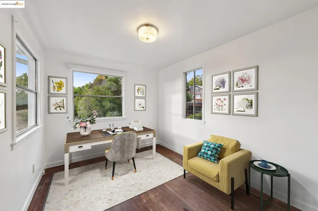 a view of a city with lots of residential buildings around and wooden fence