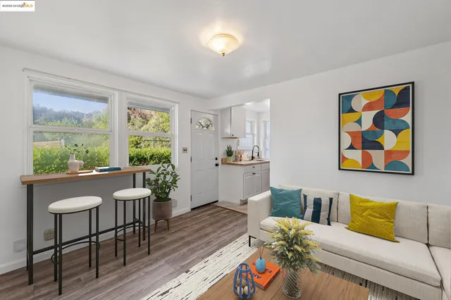 a kitchen with stainless steel appliances a sink dishwasher stove and cabinets