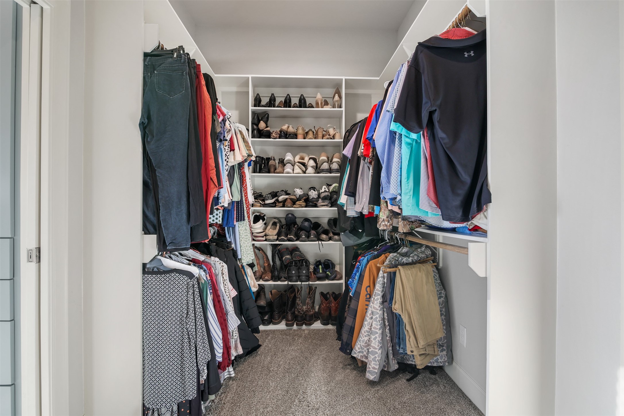 4219 Cross Cut Cleveland, TX 77328 - Photo 15 of 34 a view of walk in closet with clothes