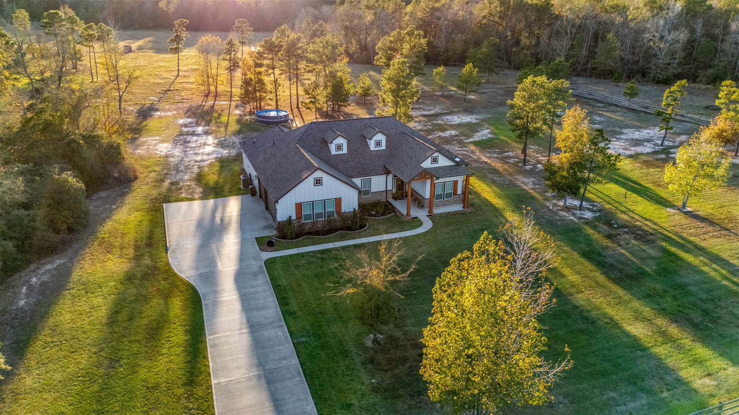 4219 Cross Cut Cleveland, TX 77328 - Photo 27 of 34 an aerial view of a house with a swimming pool