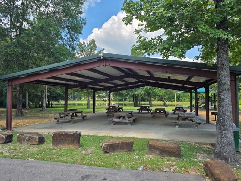 4219 Cross Cut Cleveland, TX 77328 - Photo 33 of 34 a view of patio with table and chairs under an umbrella with a barbeque