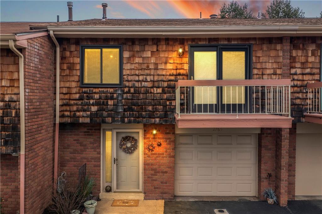 a front view of a house with a glass door