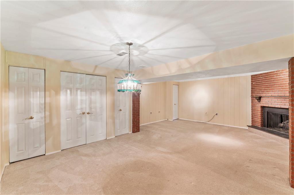 2765 Bingham Drive Pittsburgh, PA 15241 - Photo 16 of 25 an empty room with fireplace and windows