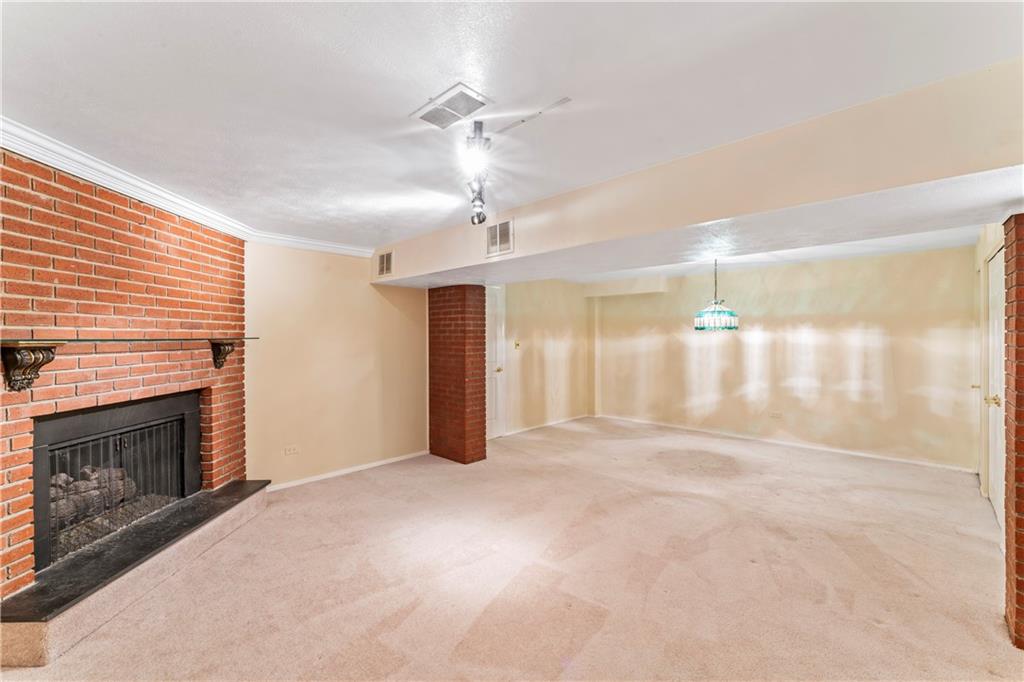 2765 Bingham Drive Pittsburgh, PA 15241 - Photo 18 of 25 a view of an empty room with a fireplace and a window