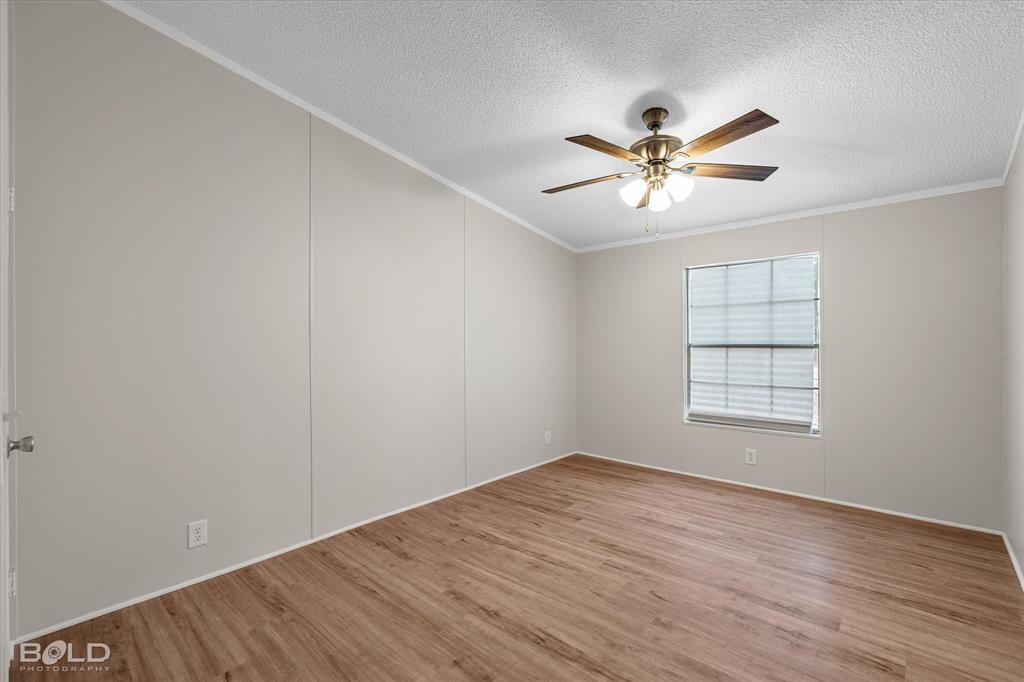 171 7 Pines Road Benton, LA 71006 - Photo 25 of 39 wooden floor in an empty room with a window