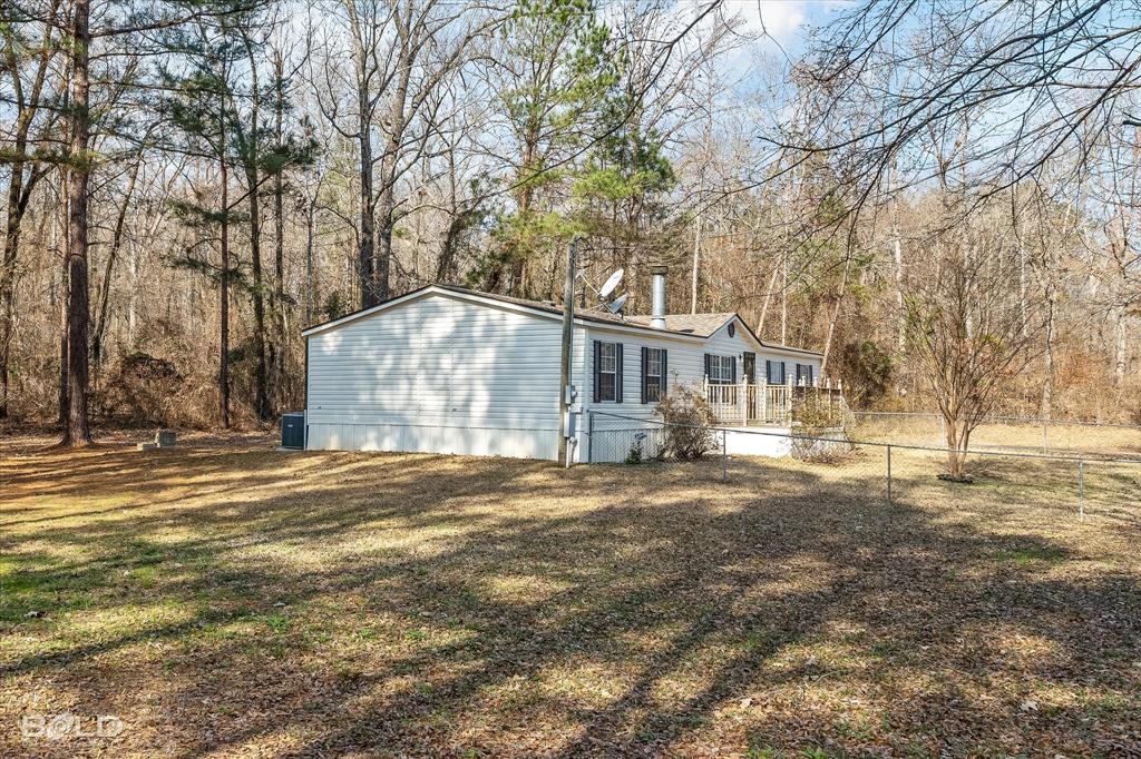 171 7 Pines Road Benton, LA 71006 - Photo 29 of 39 a front view of a house with a yard and covered with snow