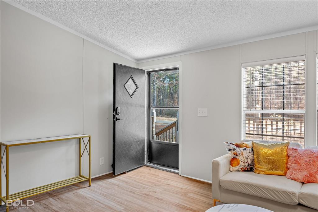 171 7 Pines Road Benton, LA 71006 - Photo 3 of 39 a living room with furniture and a window