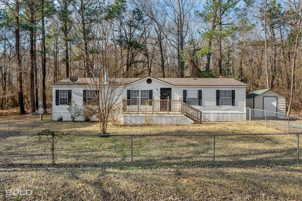 171 7 Pines Road Benton, LA 71006 - Photo 35 of 39 front view of a house with a yard
