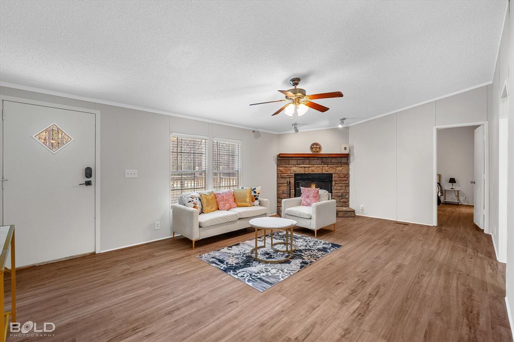 171 7 Pines Road Benton, LA 71006 - Photo 4 of 39 a living room with furniture and a fireplace