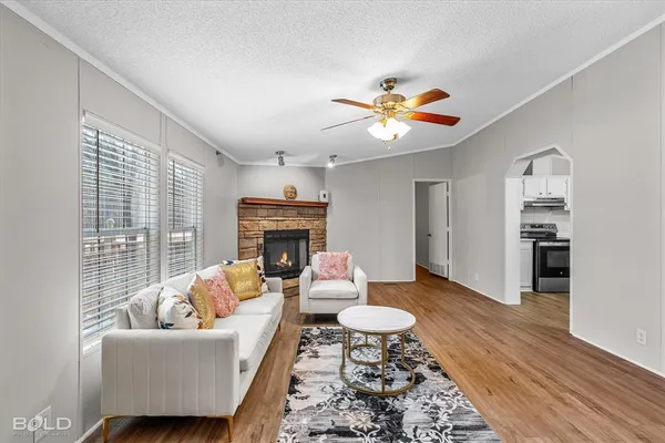 a living room with furniture and a fireplace