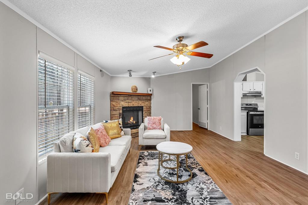 171 7 Pines Road Benton, LA 71006 - Photo 5 of 39 a living room with furniture and a fireplace