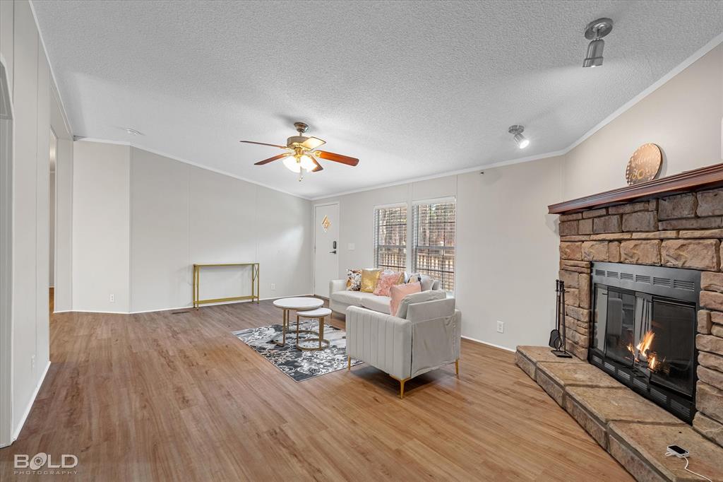 171 7 Pines Road Benton, LA 71006 - Photo 7 of 39 a living room with furniture and a fireplace