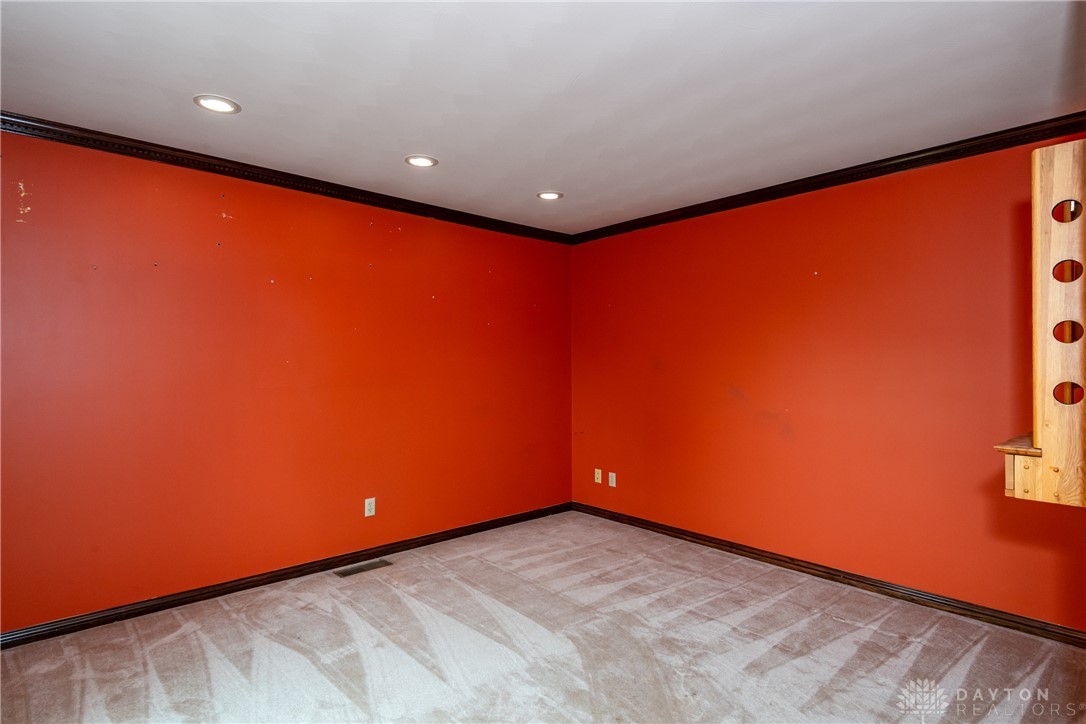9981 Ridge Acres Lane Englewood, OH 45322 - Photo 18 of 73 This versatile room features vibrant walls, comfortable carpet, and efficient recessed lighting.