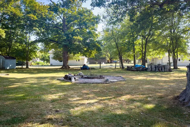 a backyard of a house with trampoline