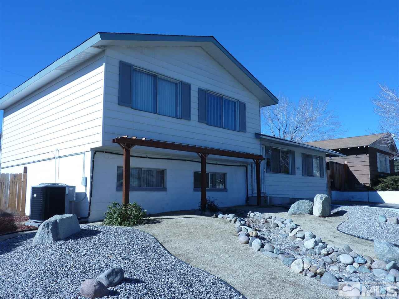 3455 Yosemite Place Reno, NV 89503 - Photo 1 of 1 a front view of a house with a yard