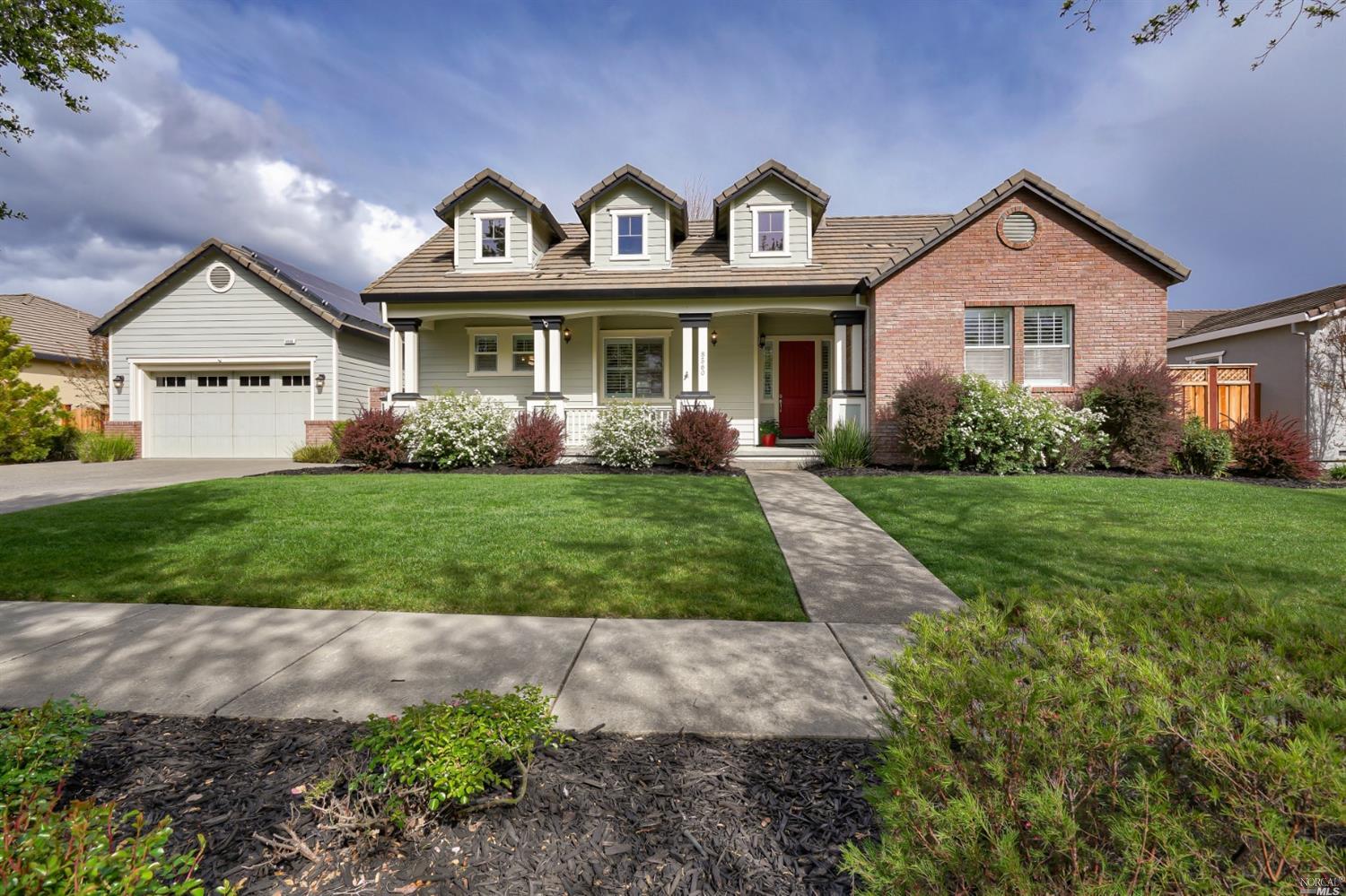 a front view of a house with garden