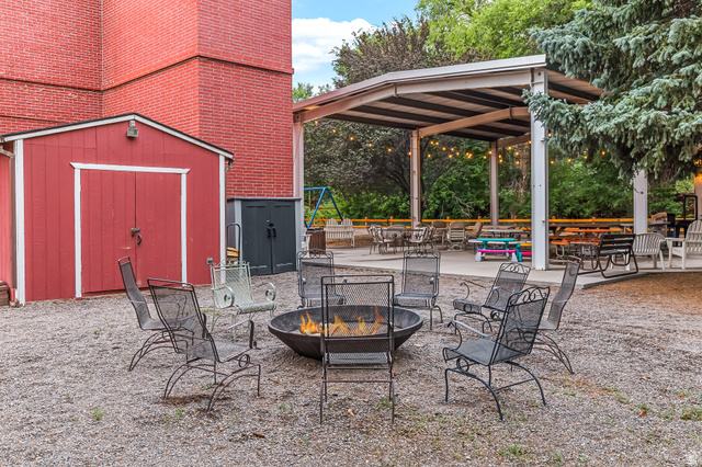 21 North Main Street Kingston, UT 84743 - Photo 25 of 107 View of patio / terrace with a storage shed and a fire pit