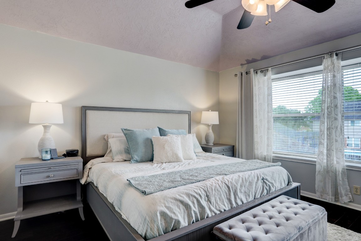1611 Falcon Ridge Boulevard Friendswood, TX 77546 - Photo 8 of 11 The primary bedroom is located upstairs and looks out into the backyard. High ceiling and large window.