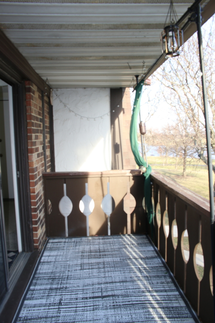 2 Timber Lane, Unit 17 Vernon Hills, IL 60061 - Photo 23 of 28 a view of a entryway door with wooden floor