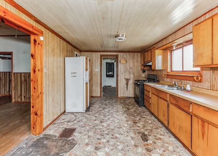 309 North 9th Street Rochelle, IL 61068 - Photo 12 of 23 a large kitchen with stainless steel appliances granite countertop a refrigerator and a stove top oven