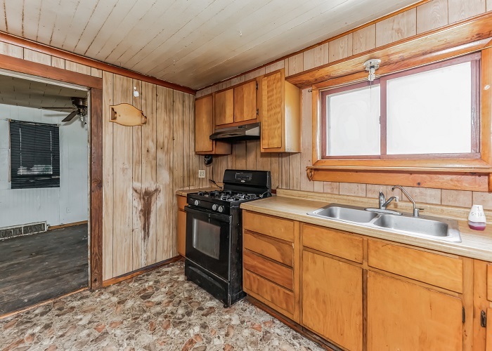 309 North 9th Street Rochelle, IL 61068 - Photo 13 of 23 a kitchen with stainless steel appliances granite countertop a stove a sink and a refrigerator