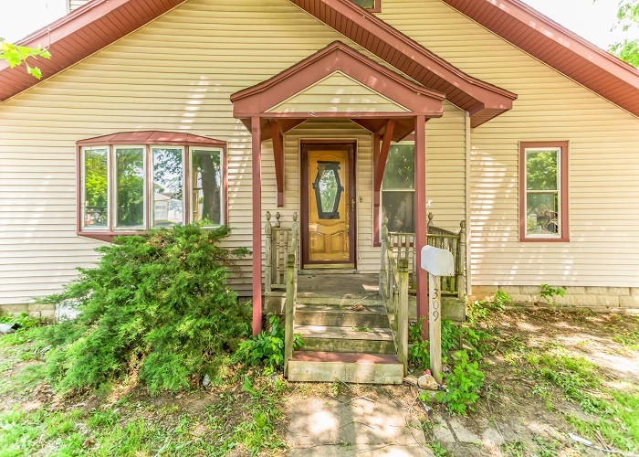 309 North 9th Street Rochelle, IL 61068 - Photo 2 of 23 a view of a brick house with a large windows