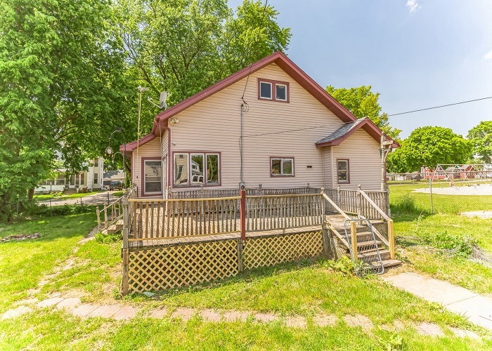 309 North 9th Street Rochelle, IL 61068 - Photo 4 of 23 a view of a house with a backyard and a patio