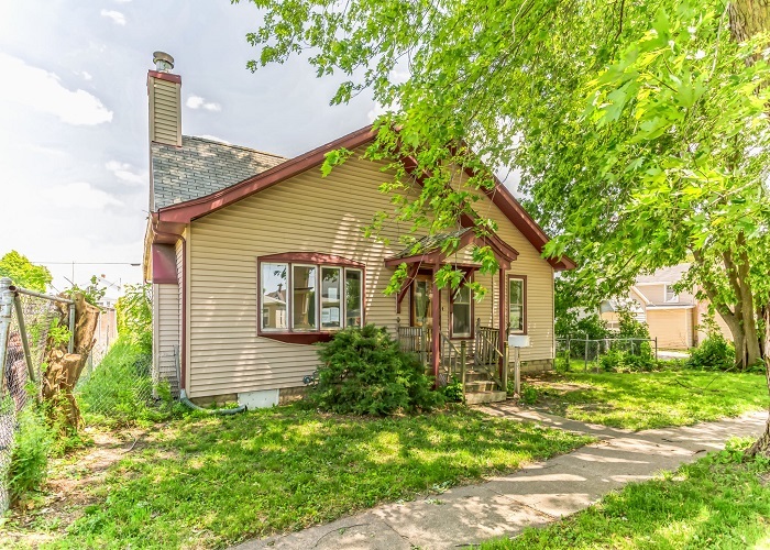 309 North 9th Street Rochelle, IL 61068 - Photo 6 of 23 a front view of a house with garden