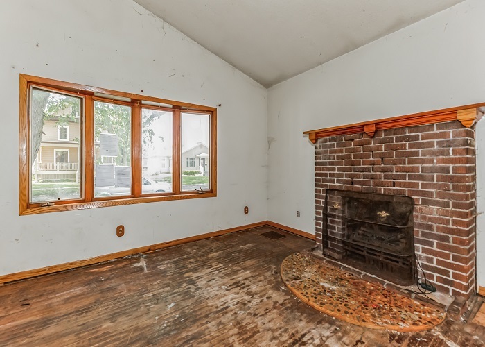 309 North 9th Street Rochelle, IL 61068 - Photo 9 of 23 a view of an empty room with wooden floor and a window