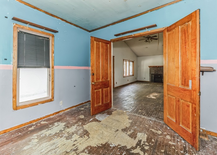 309 North 9th Street Rochelle, IL 61068 - Photo 10 of 23 a view of a hallway with wooden floor and a living room