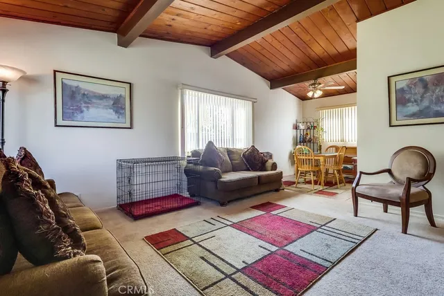 a very nice looking room with many windows and furniture