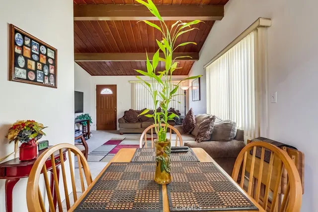 a bathroom with a toilet a sink and a window