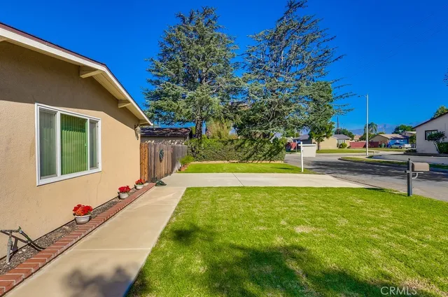 a view of a house with swimming pool and sitting area