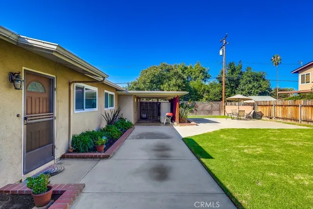a view of house with outdoor space and swimming pool