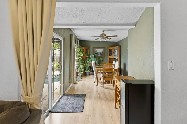 a view of a livingroom with furniture and a window