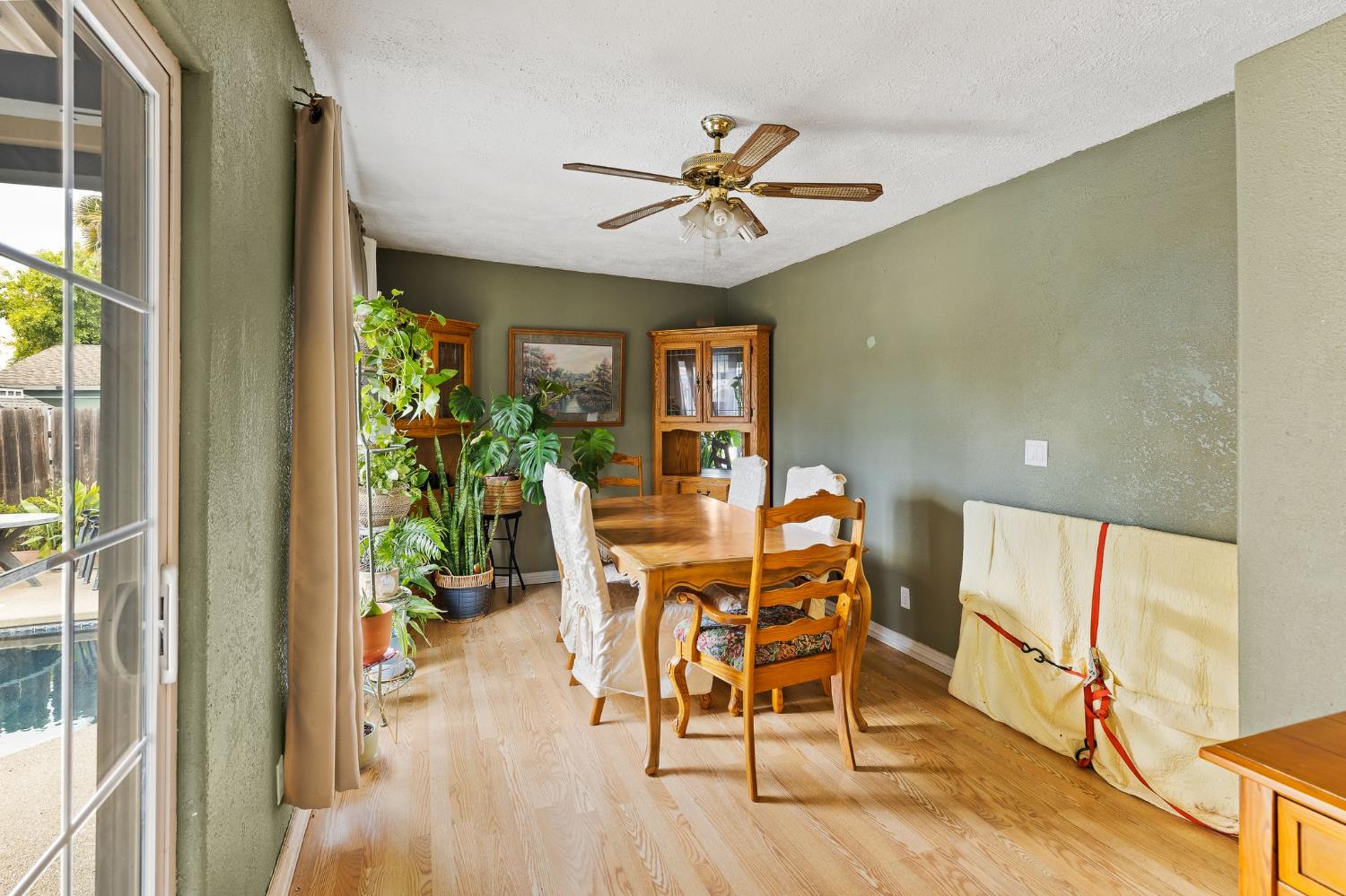 10825 Walnutwood Way Rancho Cordova, CA 95670 - Photo 13 of 34 a dining room with furniture and wooden floor