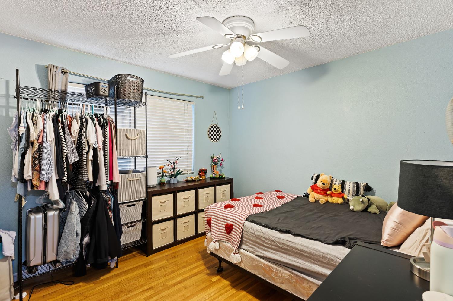 10825 Walnutwood Way Rancho Cordova, CA 95670 - Photo 16 of 34 a bedroom with a bed and a chandelier