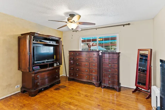 a view of an livingroom with furniture and a flat screen tv