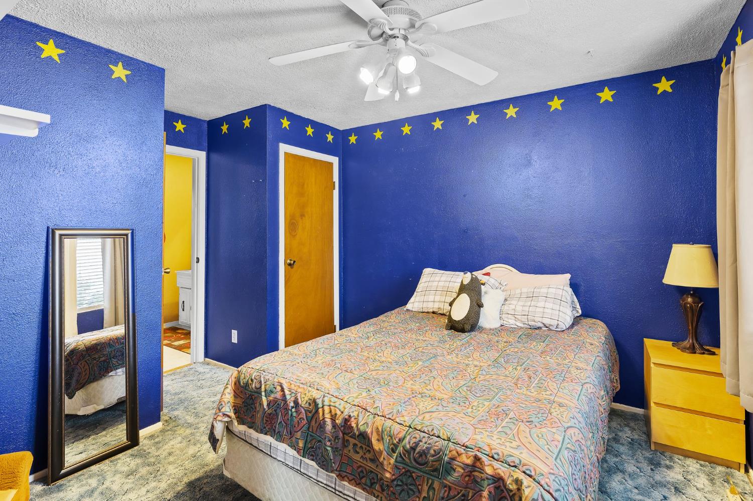 10825 Walnutwood Way Rancho Cordova, CA 95670 - Photo 26 of 34 a bedroom with a bed and a chandelier