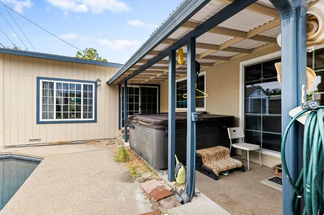 a front view of a house with outdoor seating