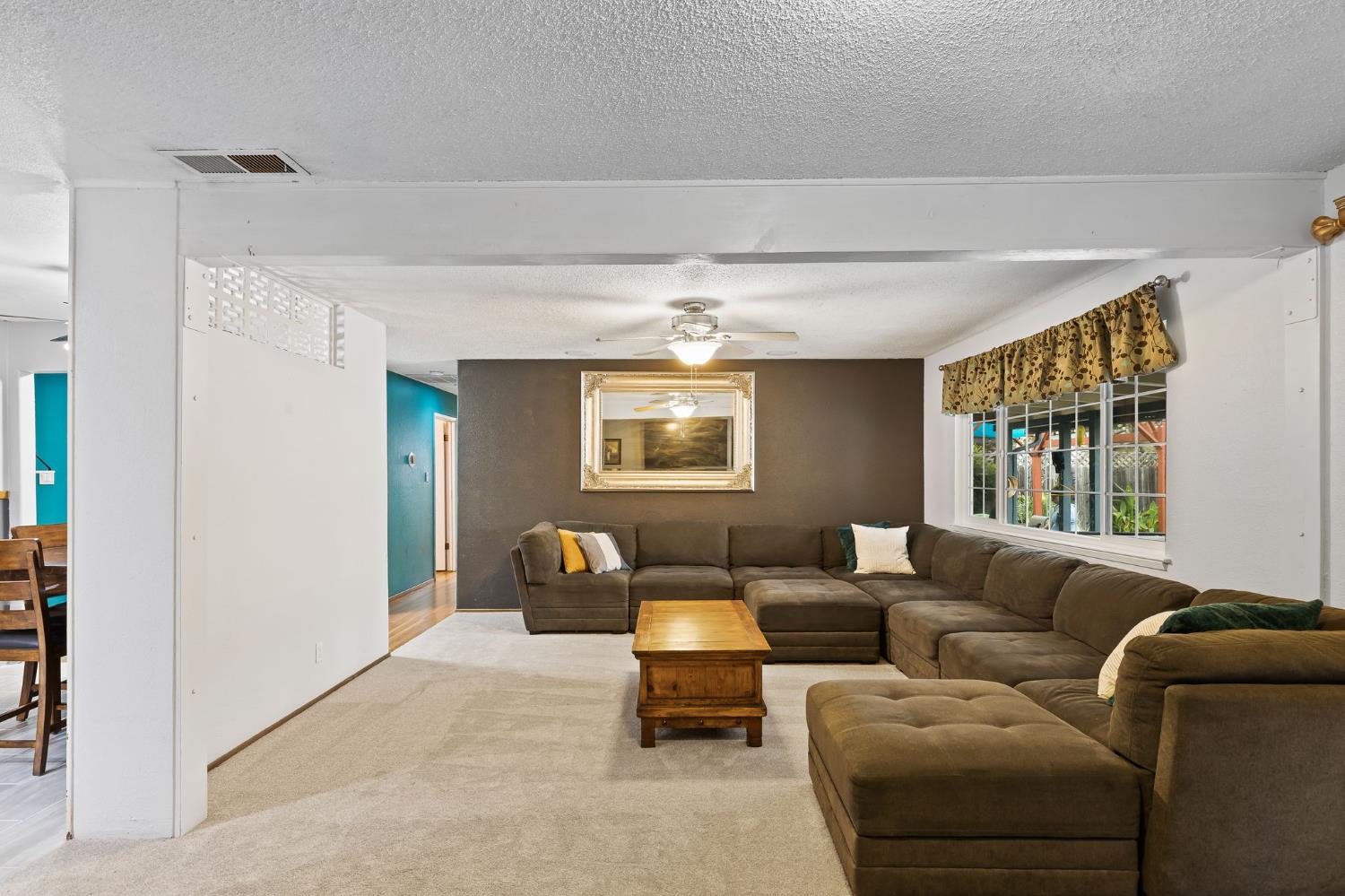 10825 Walnutwood Way Rancho Cordova, CA 95670 - Photo 6 of 34 a living room with furniture and a window