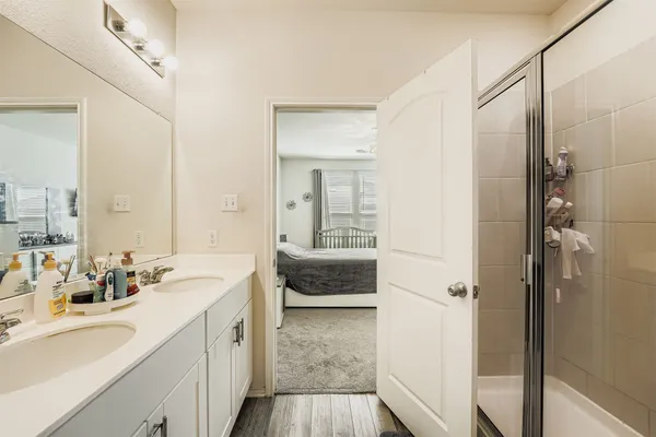 a bedroom with a bed and cabinets