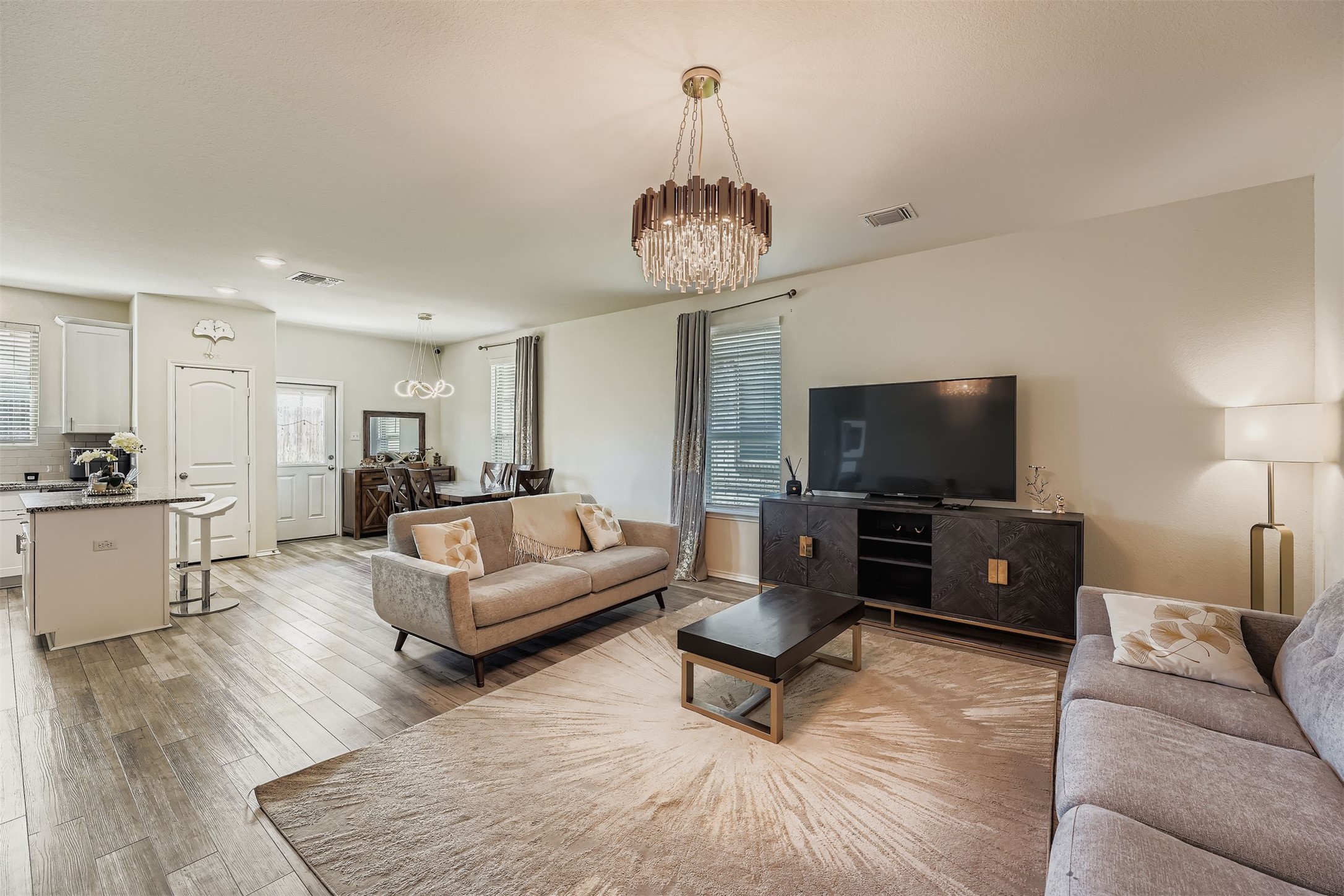 144 Gunther Way Taylor, TX 76574 - Photo 6 of 29 a living room with furniture and a flat screen tv