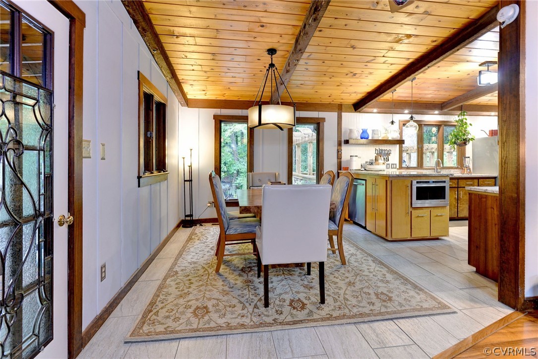 125 Rte 1601 Williamsburg, VA 23188 - Photo 16 of 46 a dining room with furniture a chandelier and wooden floor