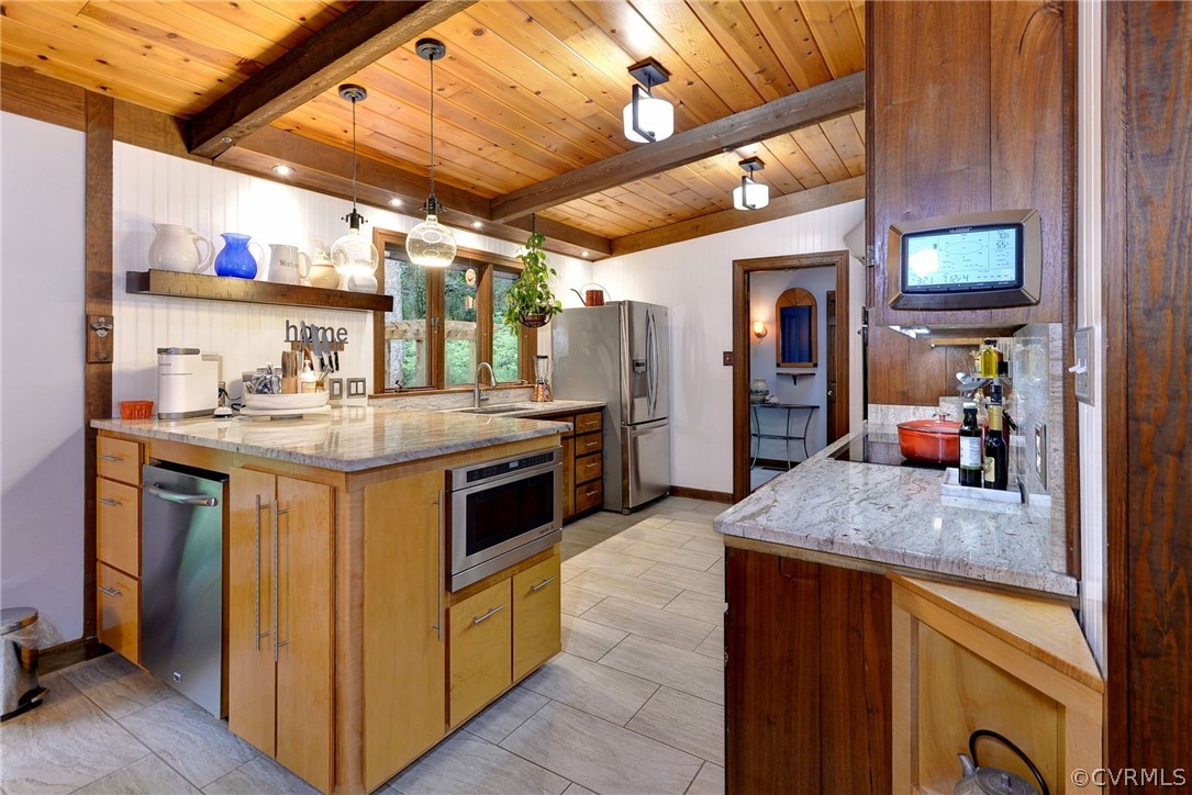125 Rte 1601 Williamsburg, VA 23188 - Photo 18 of 46 a kitchen with stainless steel appliances granite countertop a sink and a refrigerator