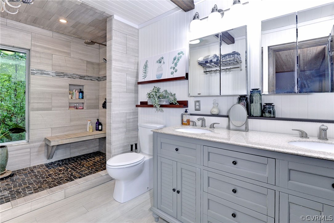 125 Rte 1601 Williamsburg, VA 23188 - Photo 26 of 46 a bathroom with a granite countertop sink a toilet and a mirror