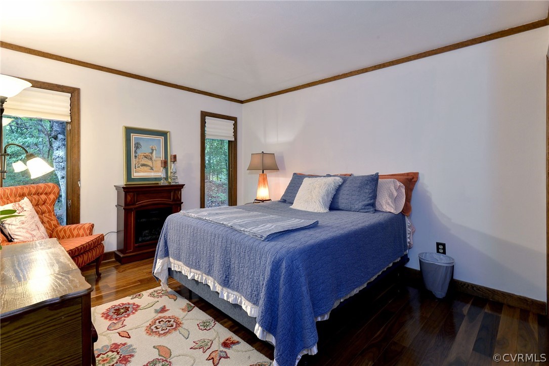 125 Rte 1601 Williamsburg, VA 23188 - Photo 27 of 46 a bedroom with a bed and wooden floor